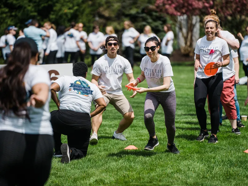 Group playing frisbee during teambuilding exercise.