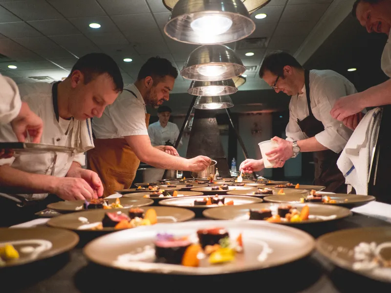 Chefs hard at work plating food at NJ Wine and Food Festival