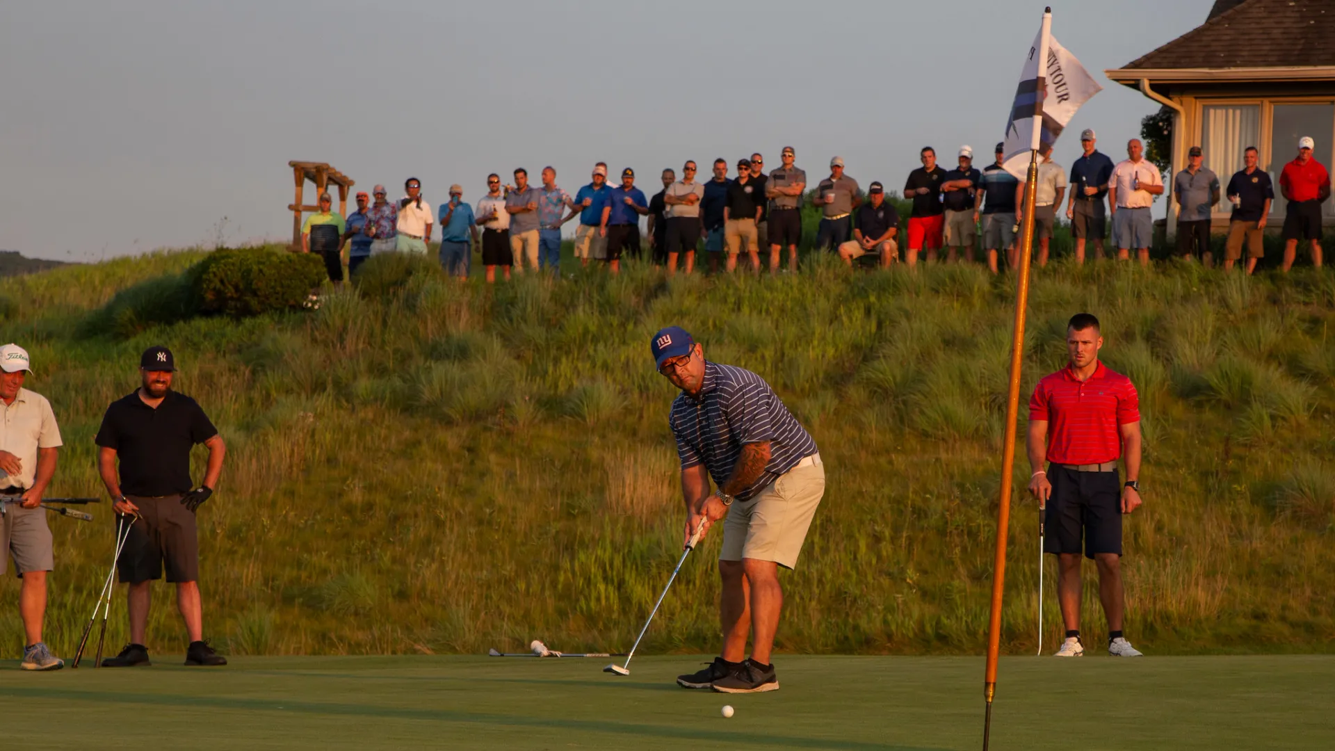 Spectators at the 2021 Law Enforcement Open watching golfer
