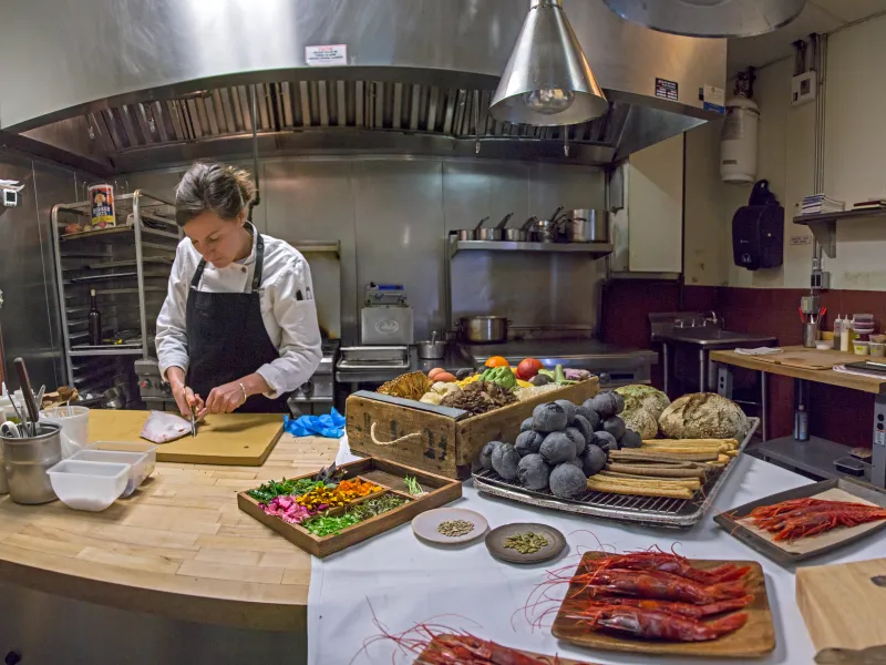 Chef Aishling preparing food in the kitchen.