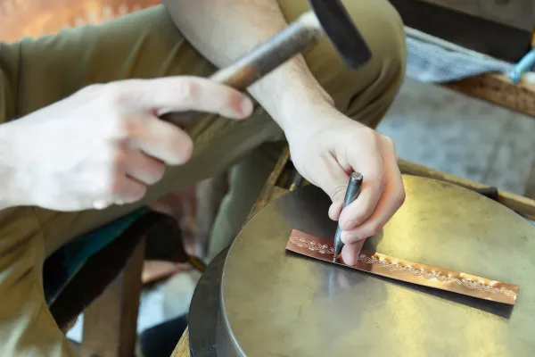Person metal stamping.