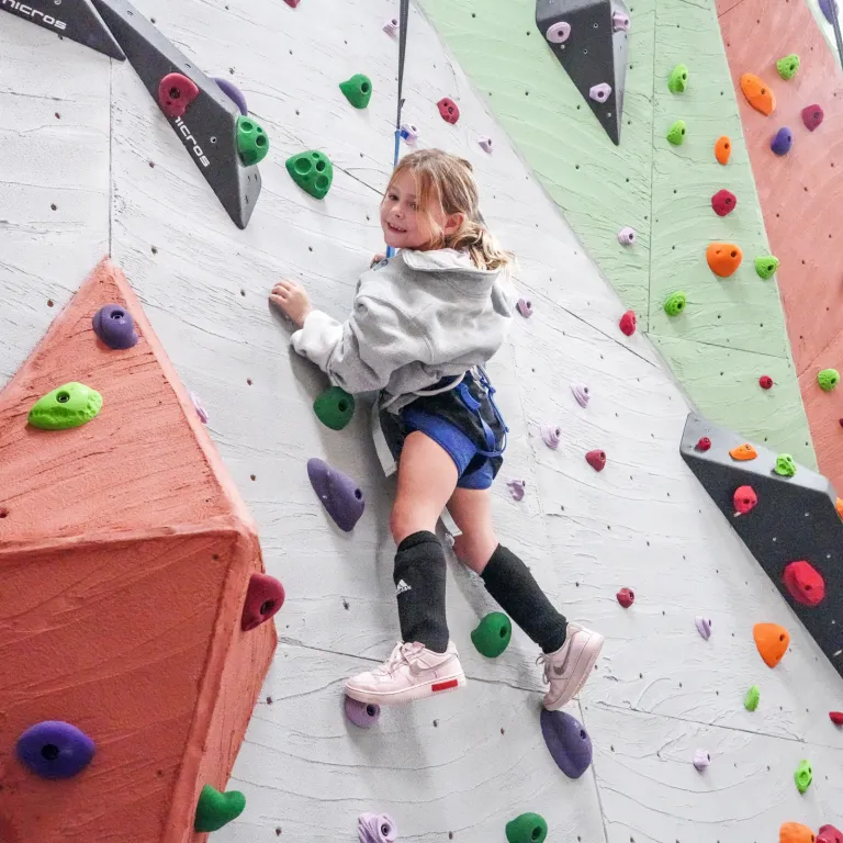 Child rock climbing.